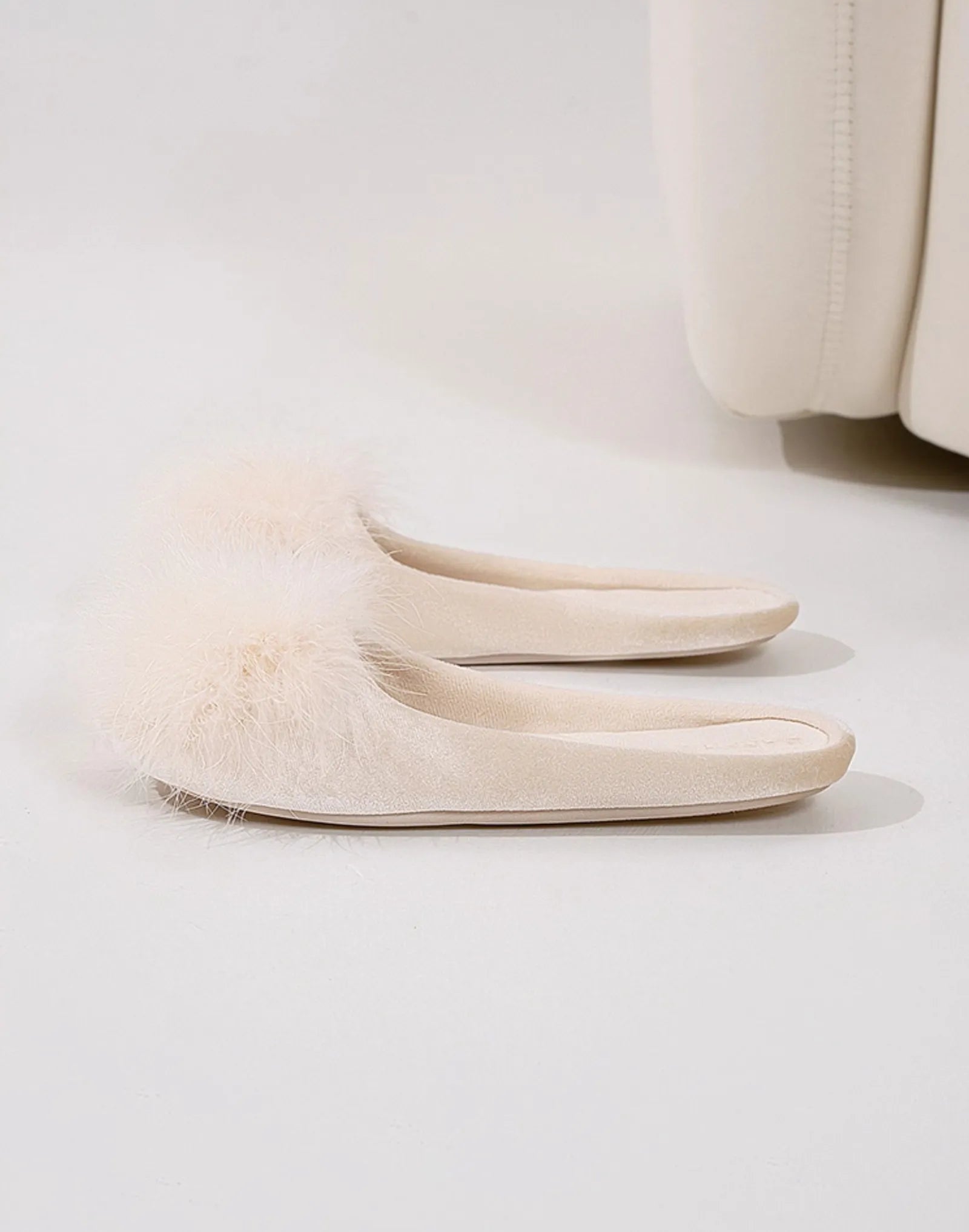 Front view of beige plush slippers showing fluffy texture - RoomDen