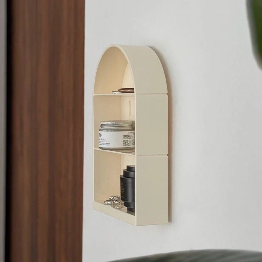 Side profile of the cream PET arched wall shelf, showing its depth and smooth finish - RoomDen.