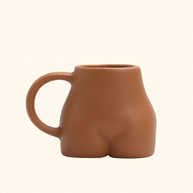 The terracotta sculptural body ceramic mug with a matte finish on a white background. - RoomDen