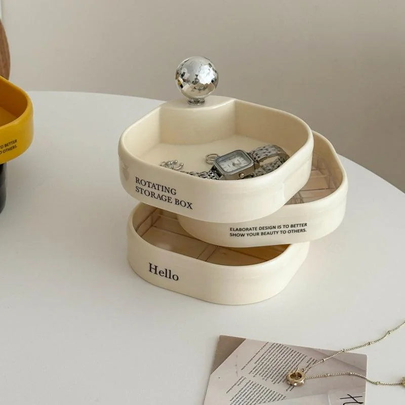 Close-up of the creamy white rotating jewelry organizer with its tiers swiveled open. - RoomDen