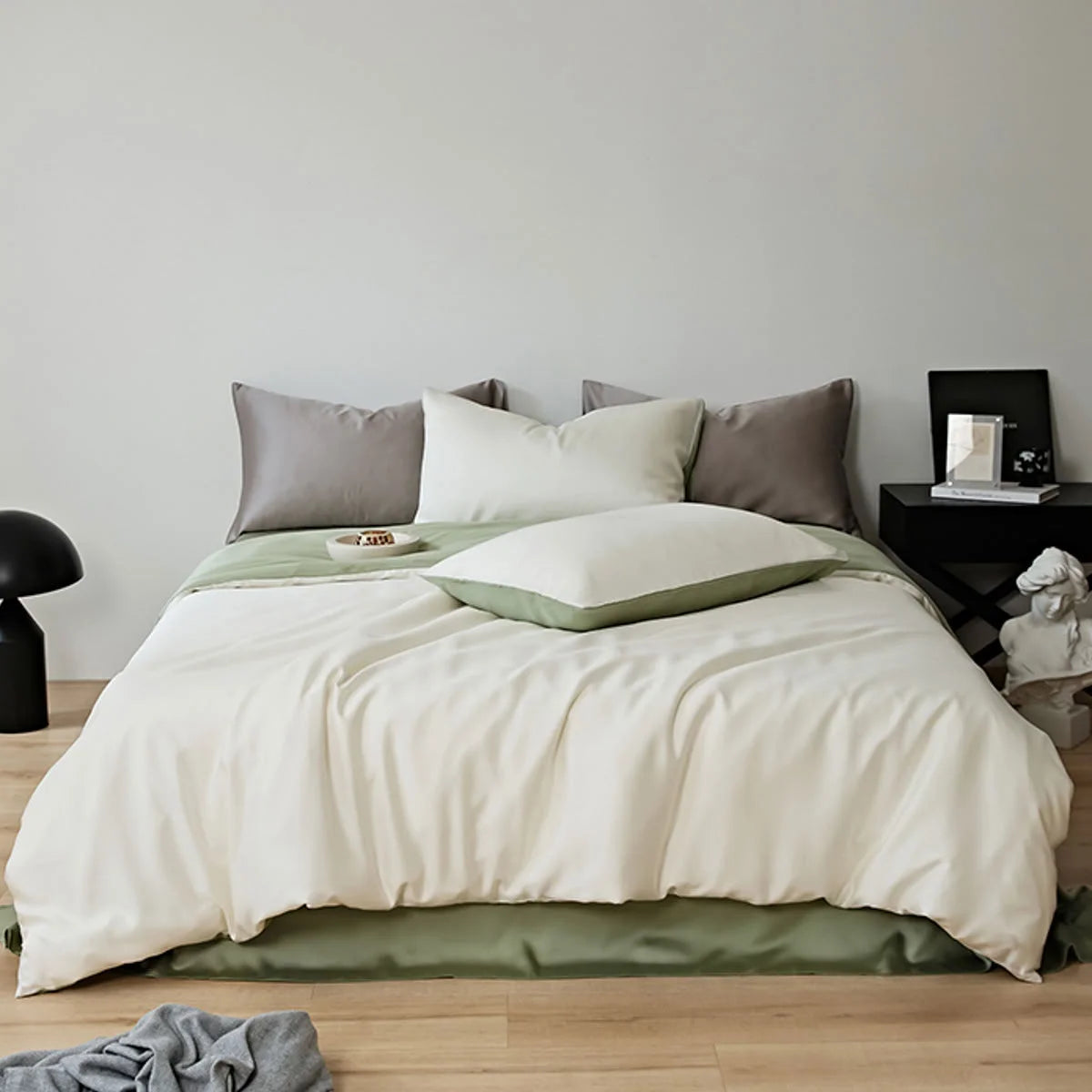 Full view of the Silky Smooth Cooling Tencel Bedding Set in White & Sage Green in a Japandi-style bedroom - RoomDen.