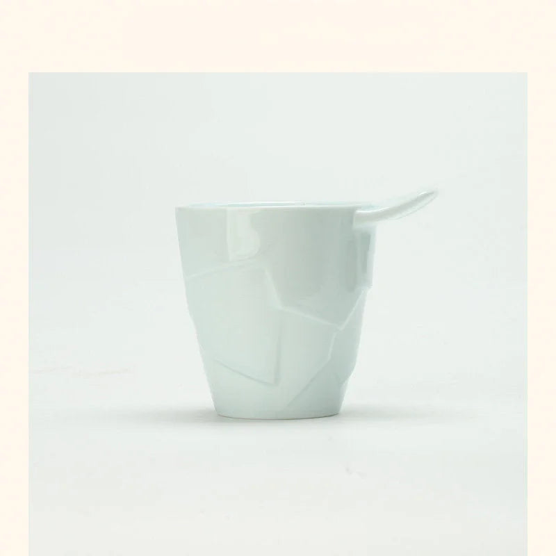 Glacial Cyan Textured Geometric Ceramic Coffee Cup with a unique fin handle against a white background - RoomDen