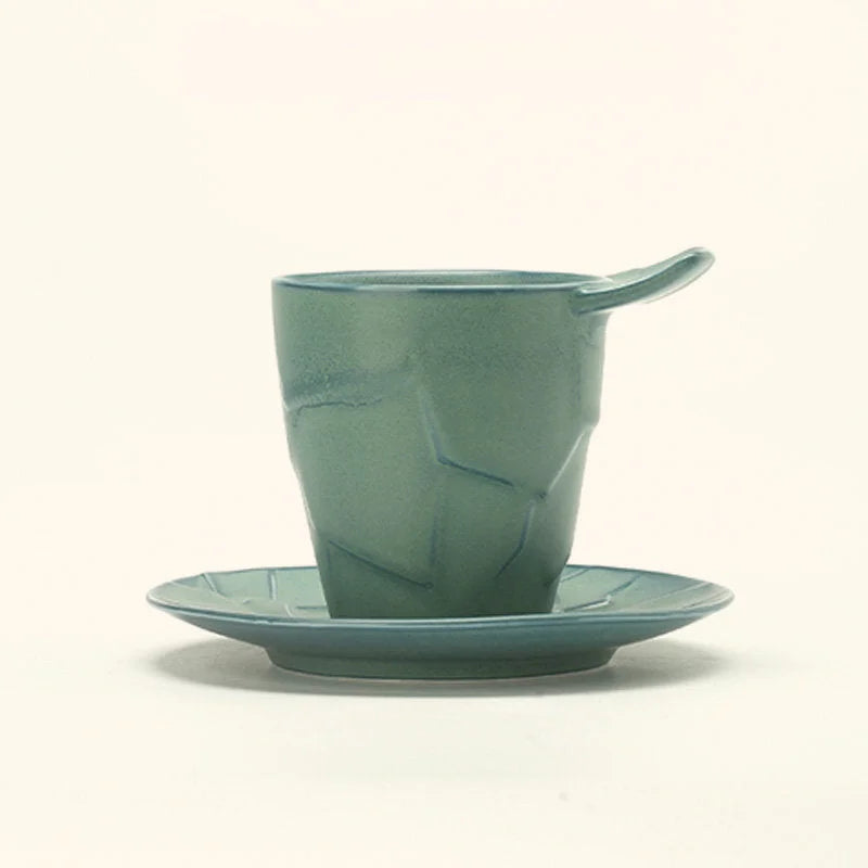 The Sage Green Textured Geometric Ceramic Cup and Saucer Set against a white background - RoomDen