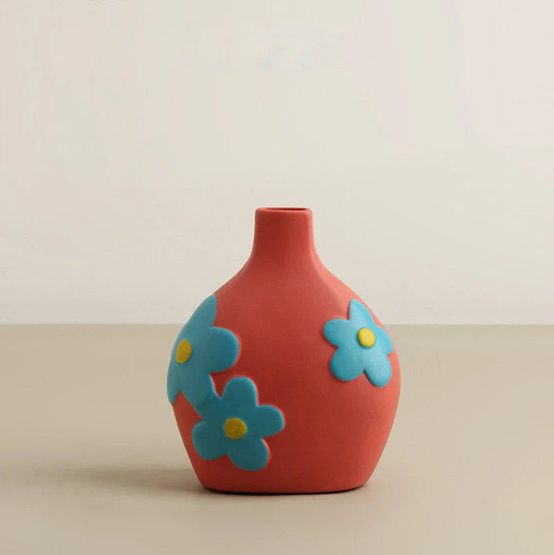 Coral Pink Pop Art Floral Ceramic Vase with blue 3D flowers on a neutral background. - RoomDen