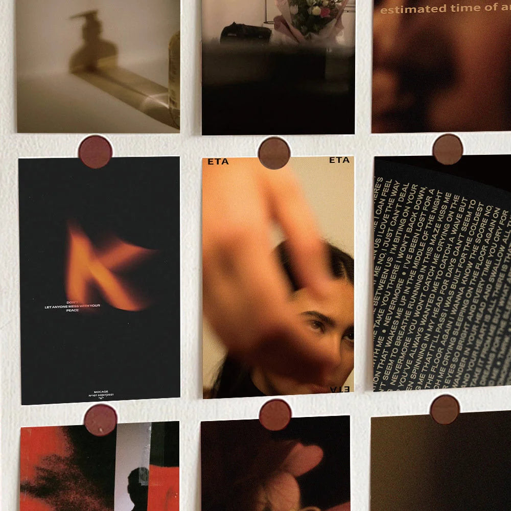 Close-up of the Moody Cinematic Wall Collage Kit featuring abstract flame and blurry portrait prints on a wall - RoomDen