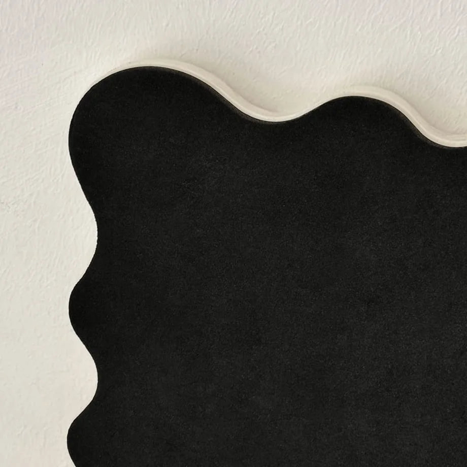 Detail shot of the black non-slip felt bottom of the wavy tray - RoomDen