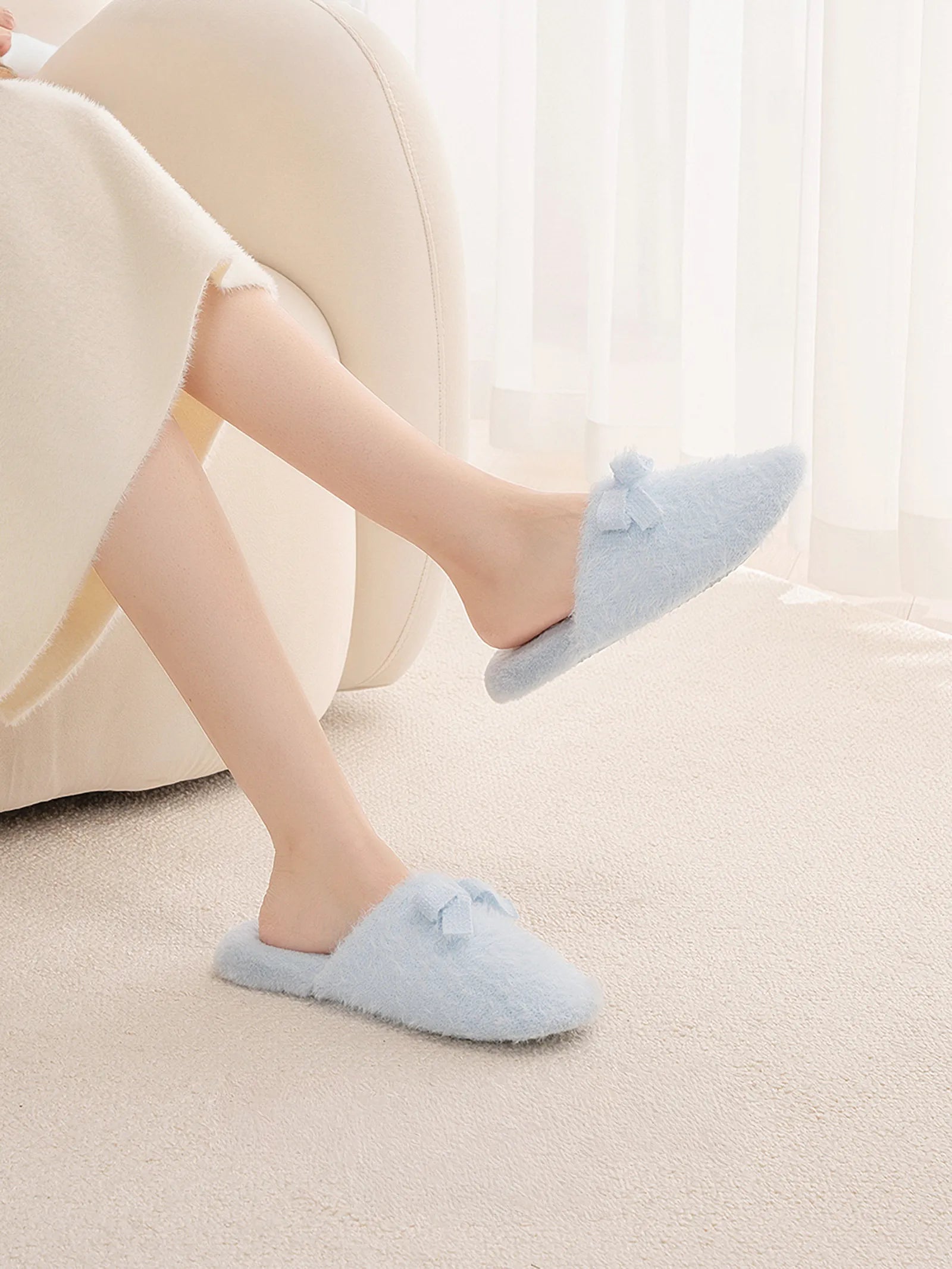 Blue Fuzzy Slippers on Model Legs Lifestyle Shot - RoomDen
