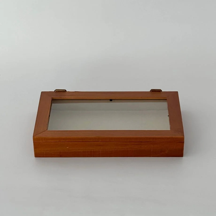 Angled view of the closed wood and glass jewelry box on a white background. - RoomDen