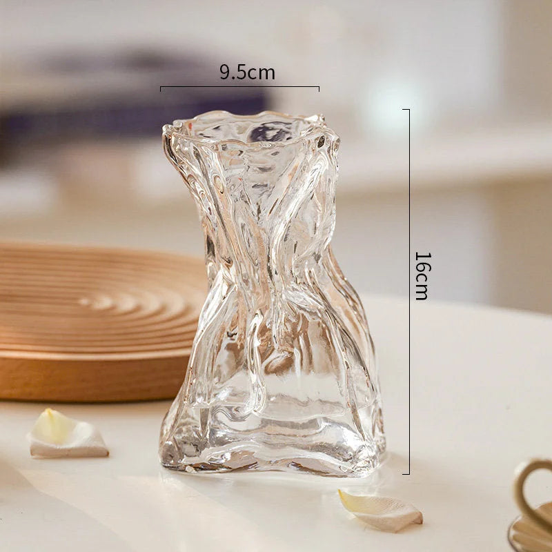 Close-up of the small clear Sculptural Crumpled Glass Vase showing its dimensions of 9.5cm by 16cm.