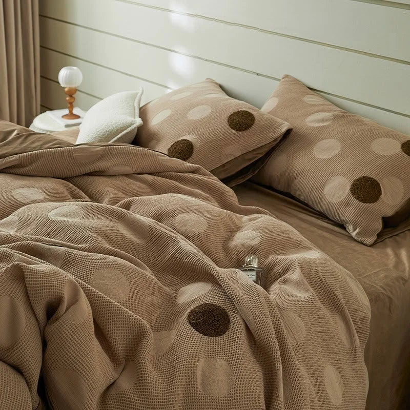 Close-up of the Mocha Polka Dot Flannel Fleece Bedding Set, showing the textured waffle weave and fluffy dots. - RoomDen