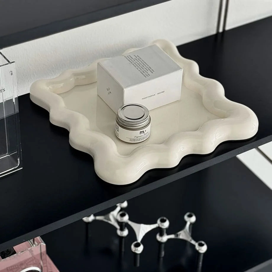 A closer look at the Off-White tray holding a small jar on a minimalist shelf - RoomDen