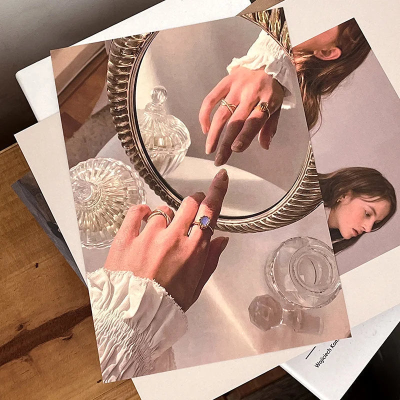 Close-up detail of a print from the wall collage kit, showing hands over a vintage mirror. - RoomDen