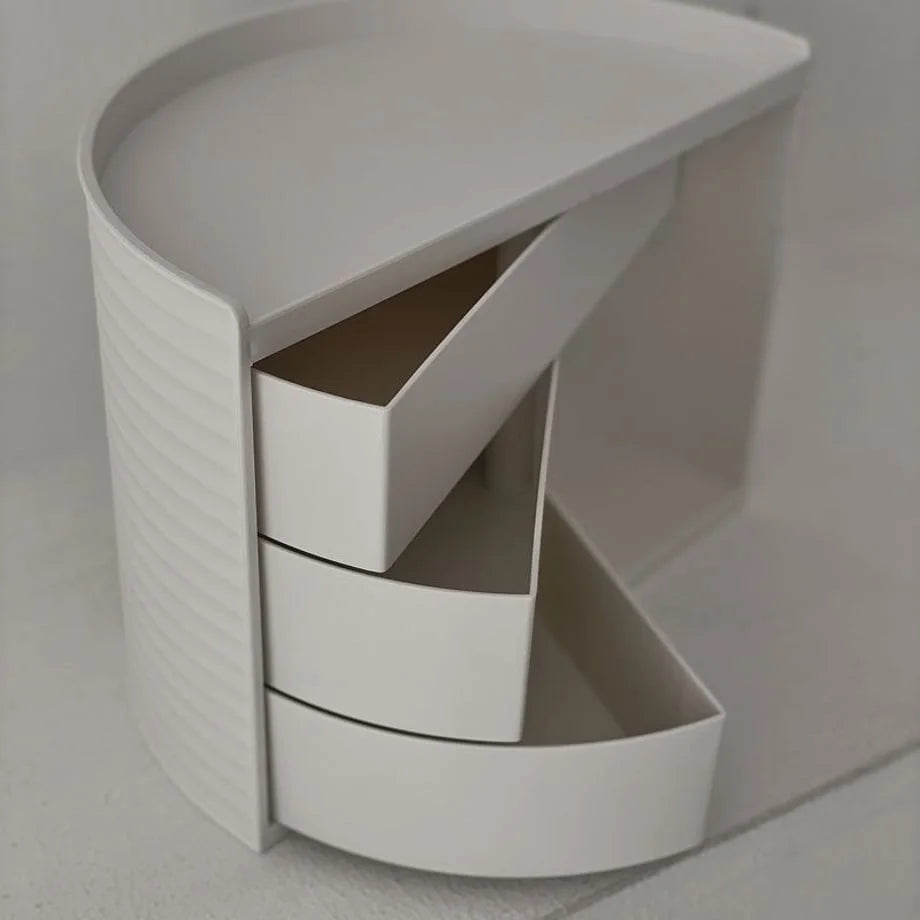 Angled view from above showing the three-tiered rotating drawers of the vanity organizer. - RoomDen