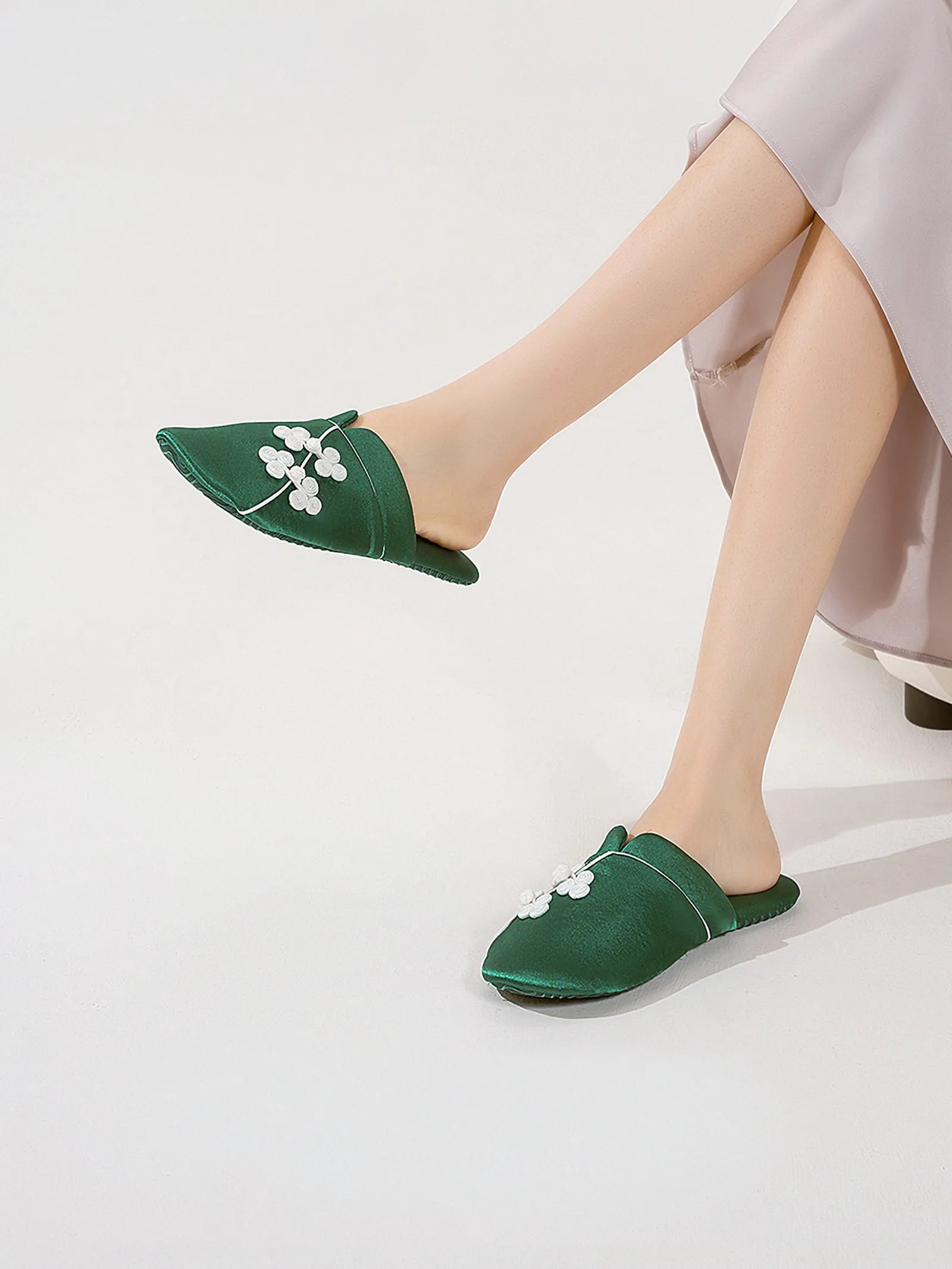 Model wearing Emerald Green floral knot slippers with silk skirt - RoomDen