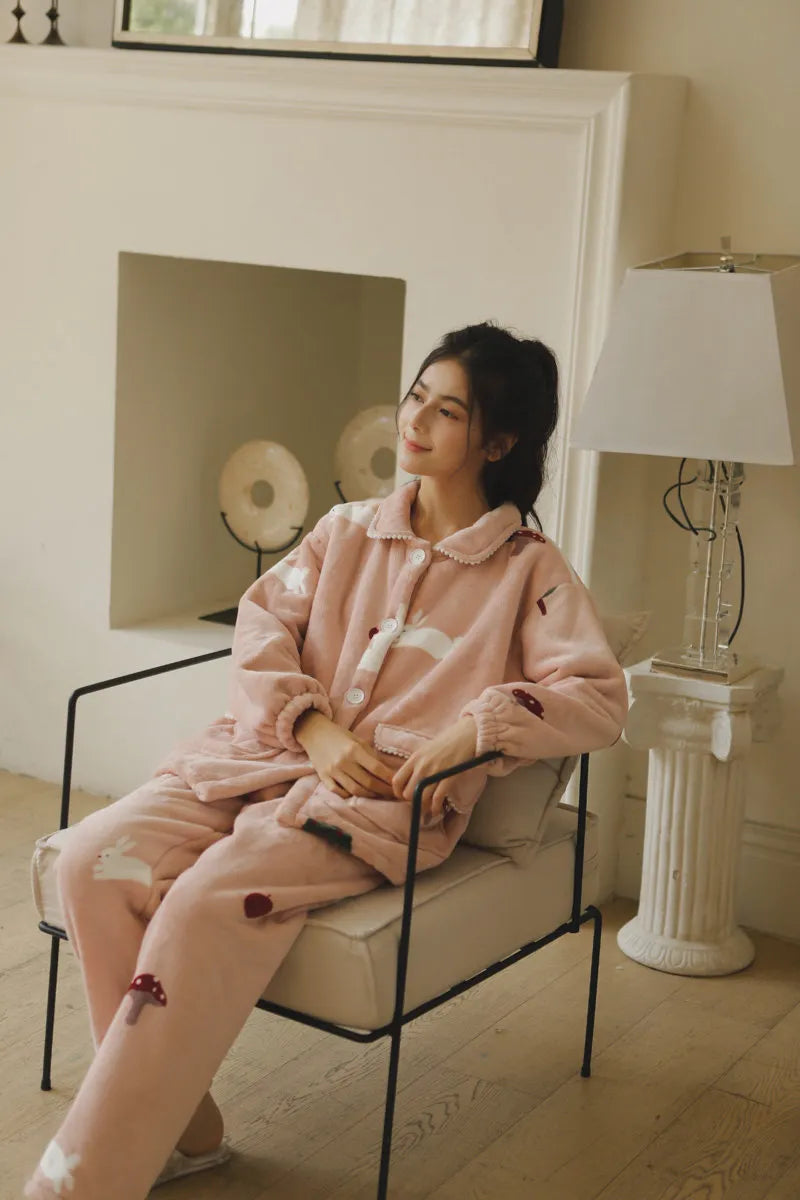 RoomDen Plush Rabbit & Mushroom Flannel Fleece Pajama Set - Pink loungewear seated pose