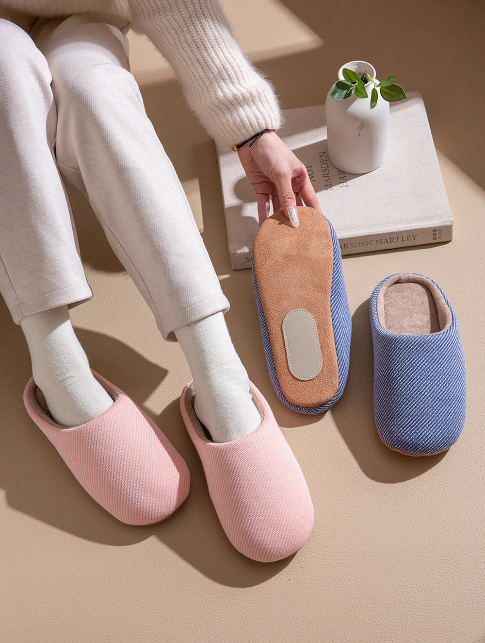 Pink ribbed cotton slippers on feet next to blue pair roomden