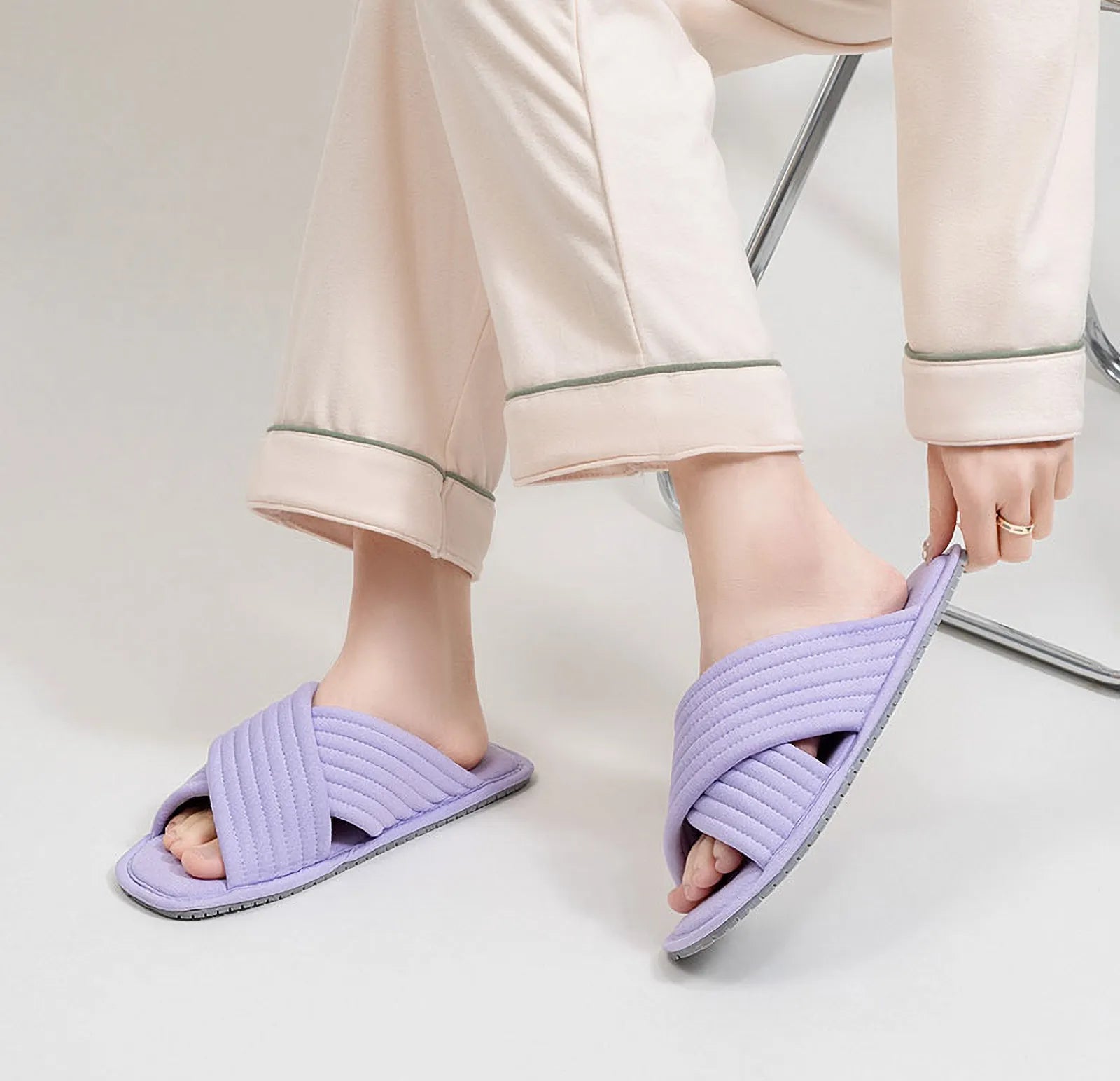 Lavender purple cotton house slippers worn on feet side view