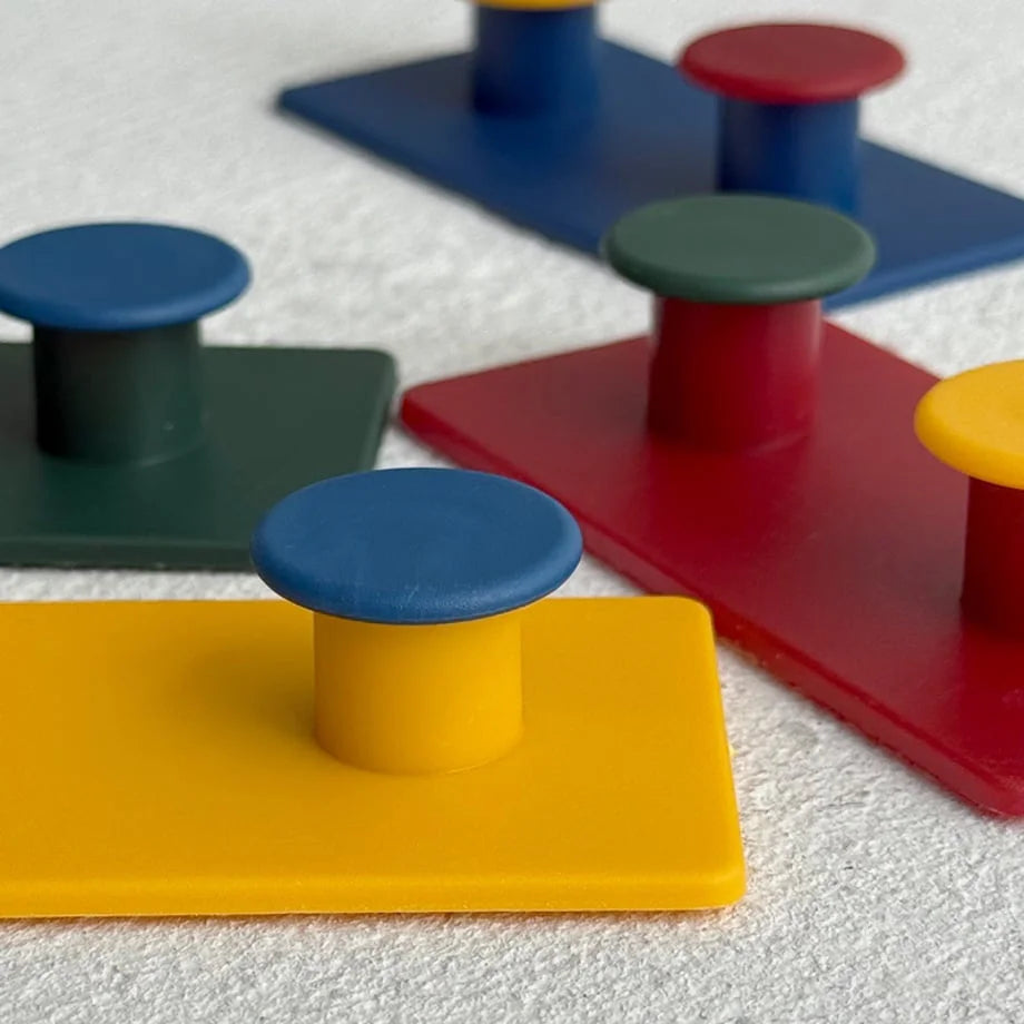 Close-up of Matte Colorblock ABS Decorative Hooks showing the vibrant primary colors and smooth texture - RoomDen.
