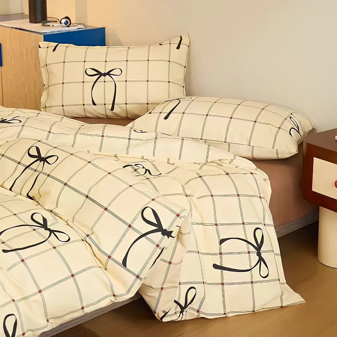 Full view of the bow and grid pattern cotton bedding set in a styled bedroom. - RoomDen