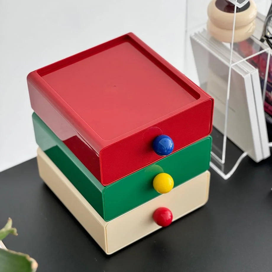 An overhead view showing the smooth top surface of the red stackable desk drawer. - RoomDen