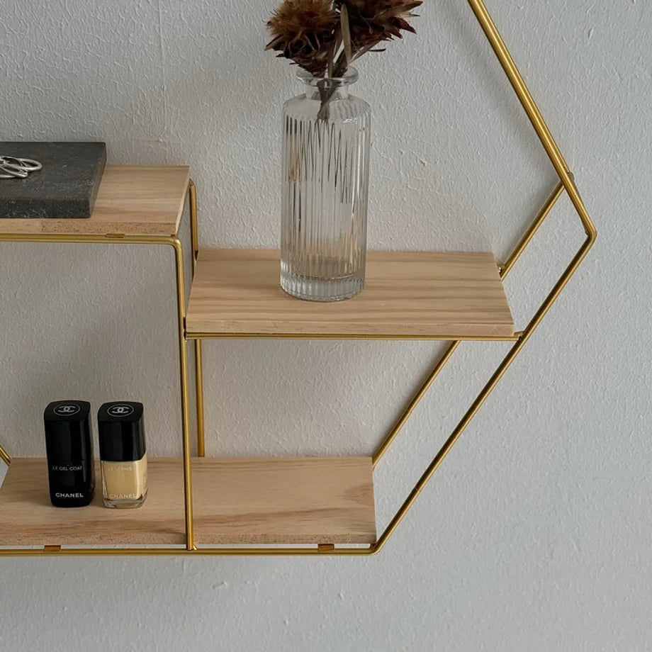 Close-up of the two-tier wooden shelves and gold wireframe of the Hexagon Wall Shelf - RoomDen