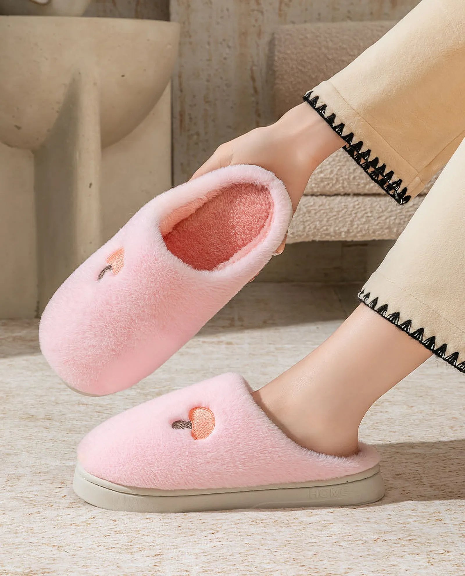 Close-up of hand holding Pink Plush Mushroom Embroidered Fleece House Slipper showing soft lining - RoomDen