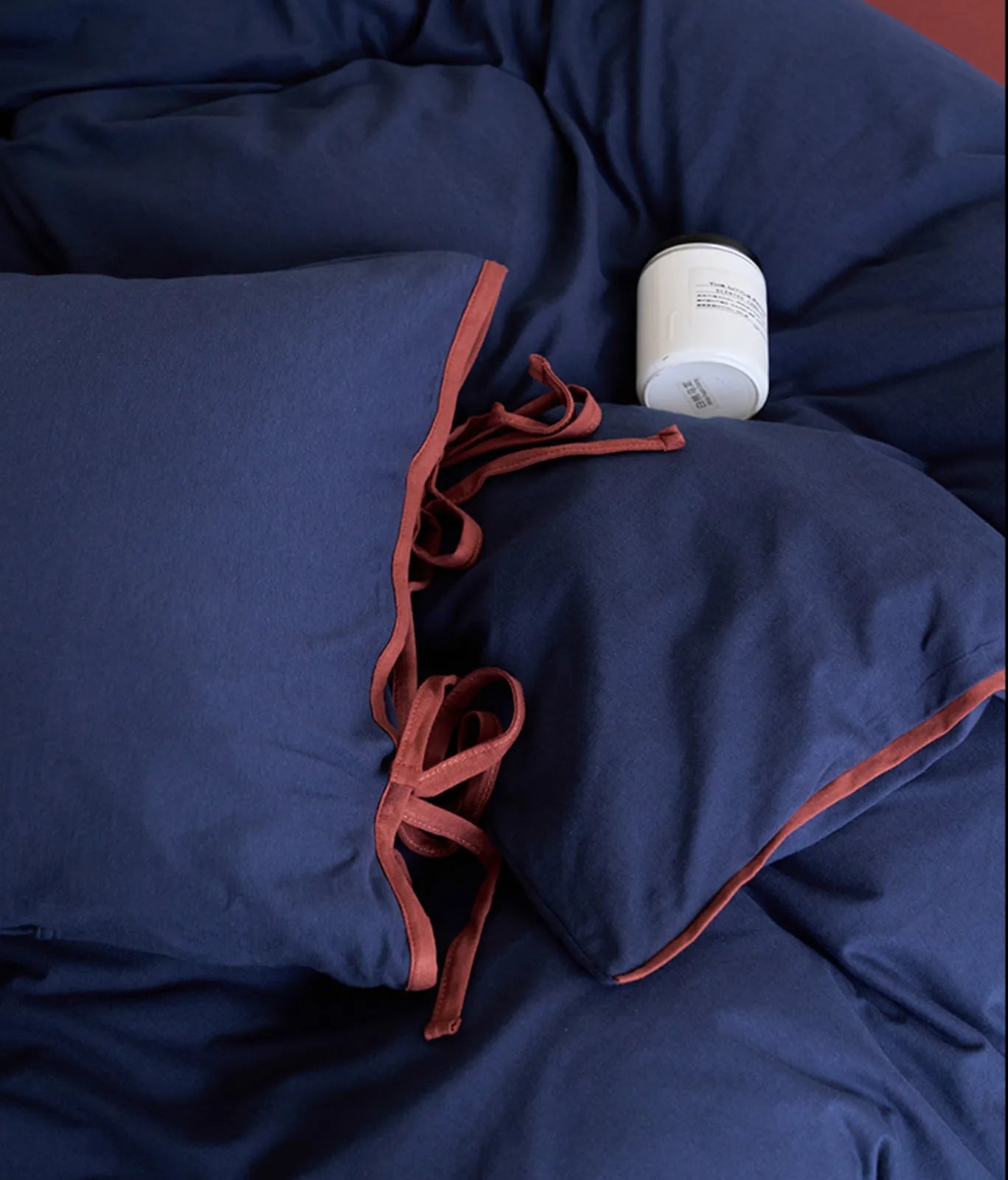 Top-down view of the rich Navy & Terracotta bedding set, showing the deep blue color. - RoomDen