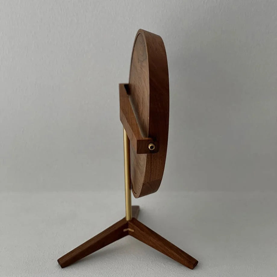 Full side view of the walnut and brass desktop mirror, highlighting its sleek profile.