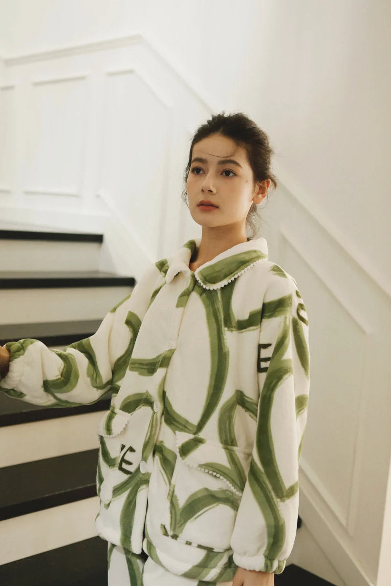 Main Image - Model wearing the Plush Graffiti Love Fleece Pajama Set on a staircase - RoomDen.