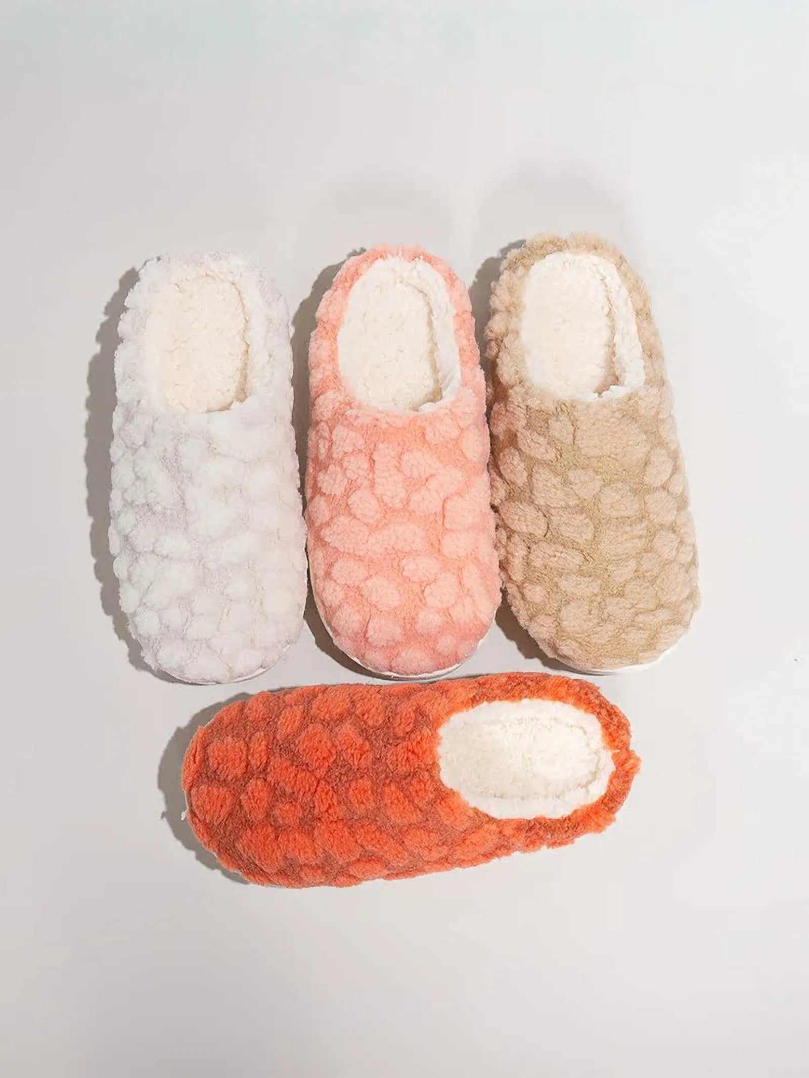 Flat lay of White Pink and Beige Textured Fleece House Slippers - RoomDen