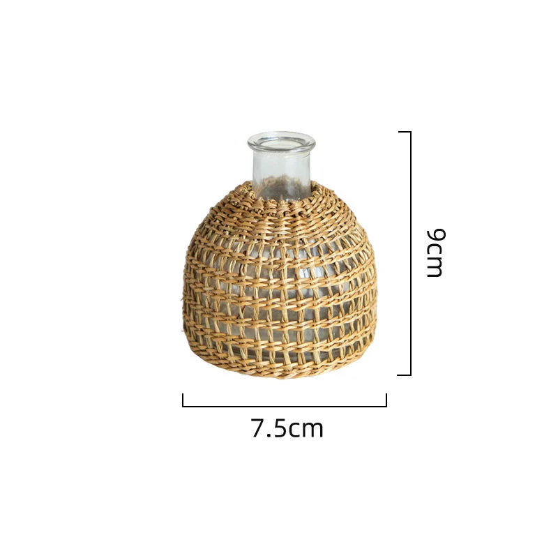 Close-up of the small Handwoven Rattan & Glass Bud Vase with dimensions shown - RoomDen.