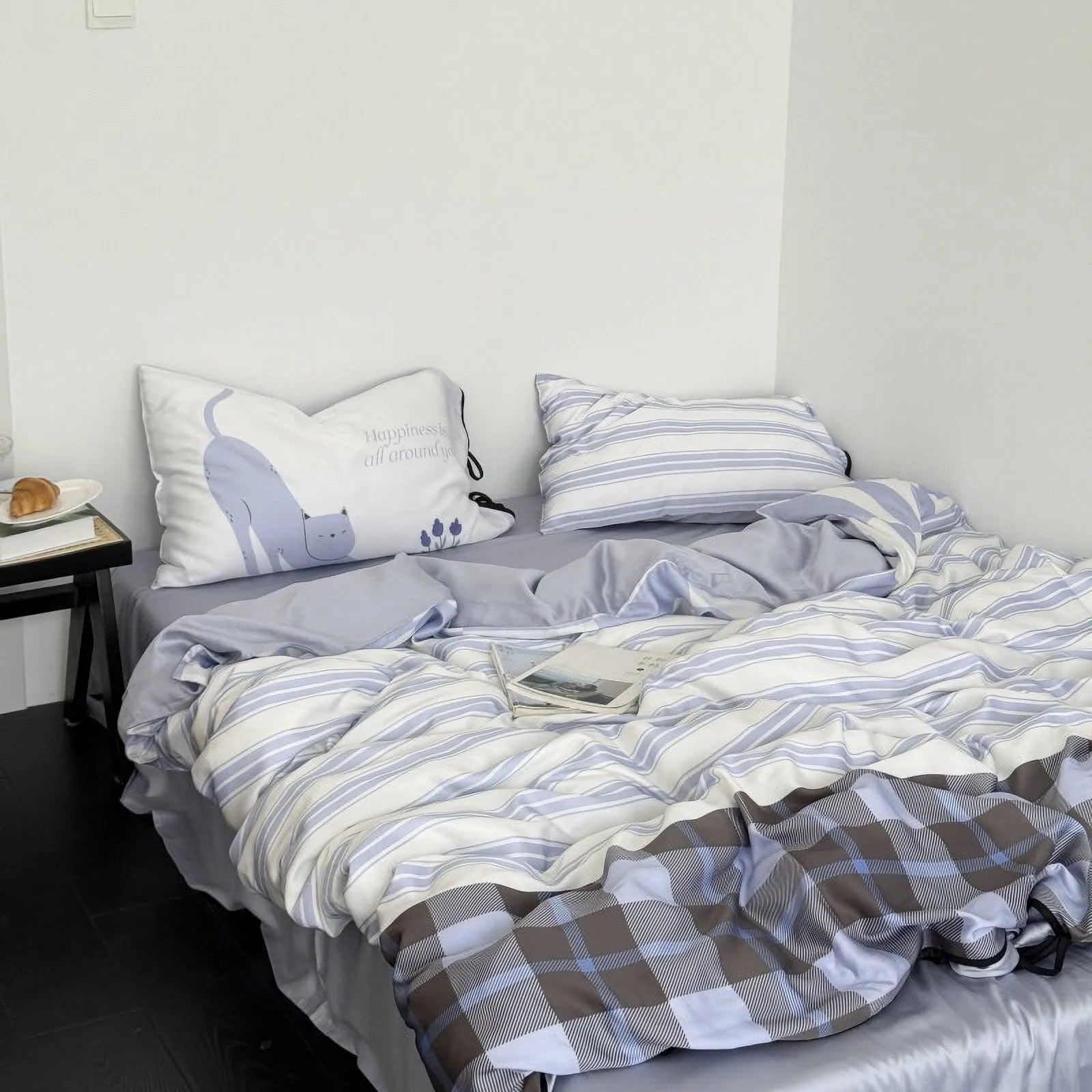 Full view of the Cat & Stripe Bedding Set on a bed, revealing the reversible plaid pattern on the duvet cover. - RoomDen