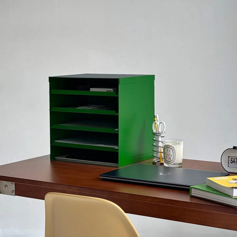 Sleek Kelly Green metal desktop organizer on a wooden desk with a laptop and candle - RoomDen.