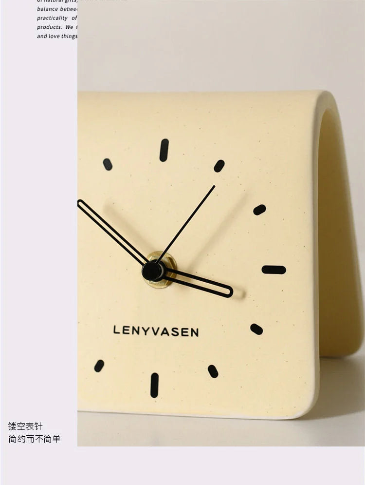 Close-up detail of the minimalist dot dial and hands on the Butter Yellow table clock - RoomDen