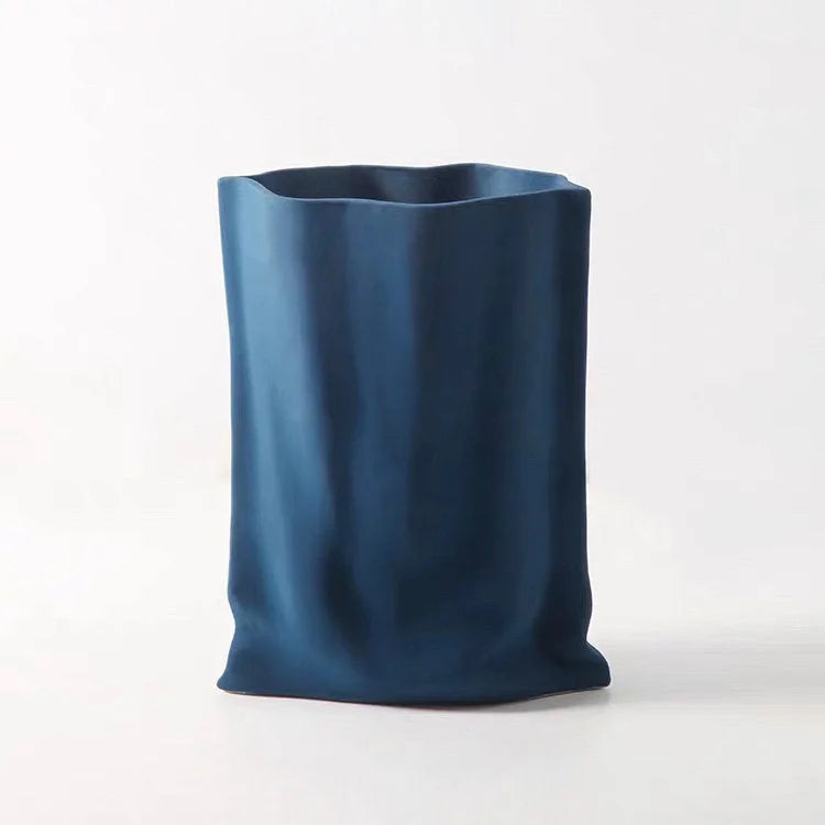 The Frosted Ruched Ceramic Paper Bag Vase in a deep, modern Indigo Blue - RoomDen.