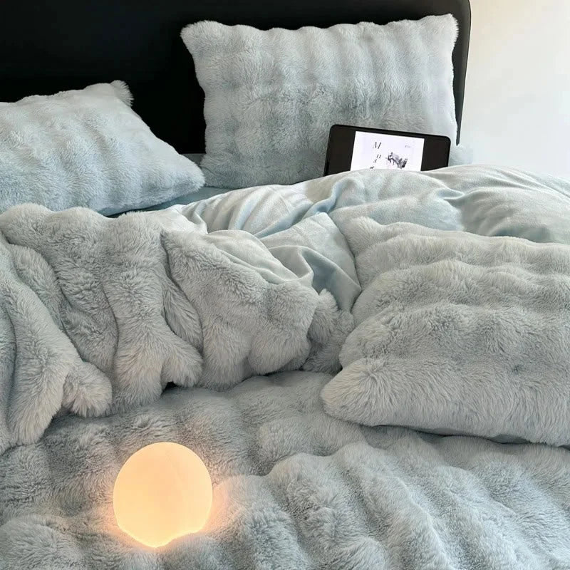 A cozy, lived-in view of the Sky Blue plush fleece bedding. - RoomDen