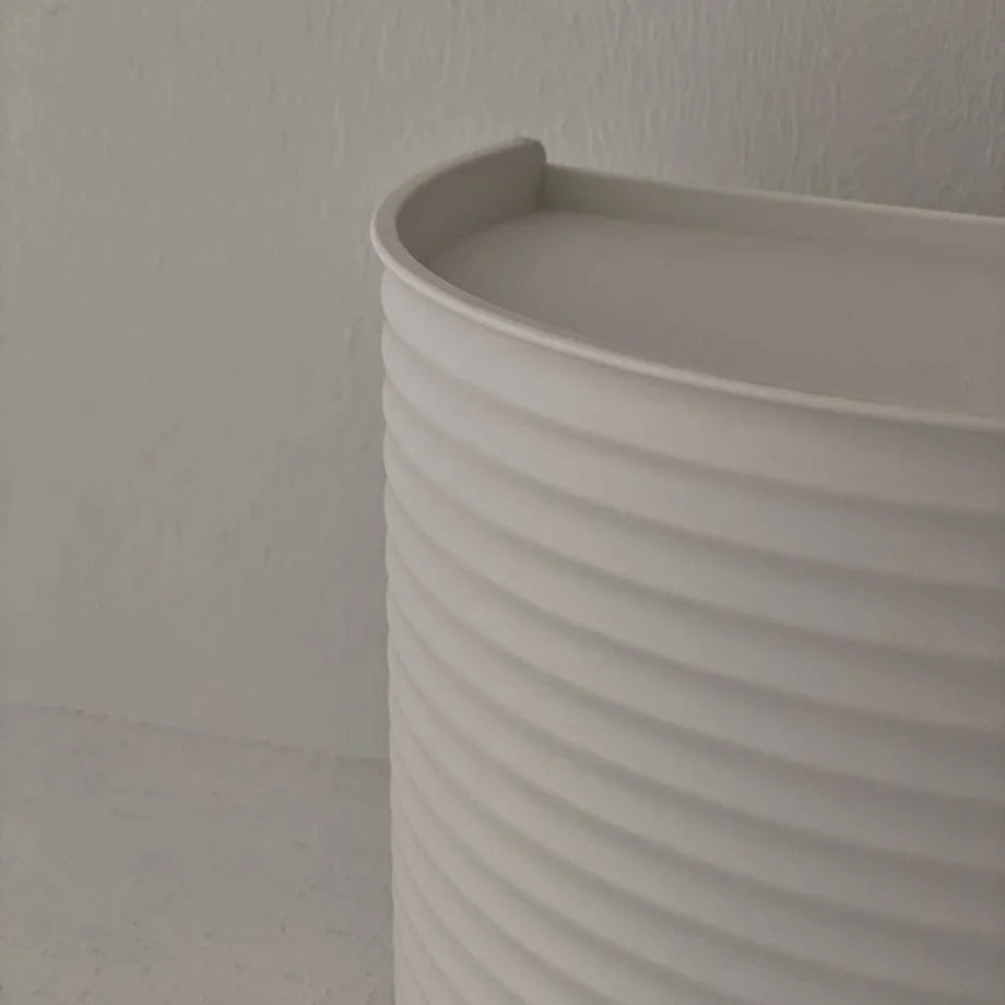 Detail shot of the ribbed texture on the side of the white ABS makeup organizer. - RoomDen