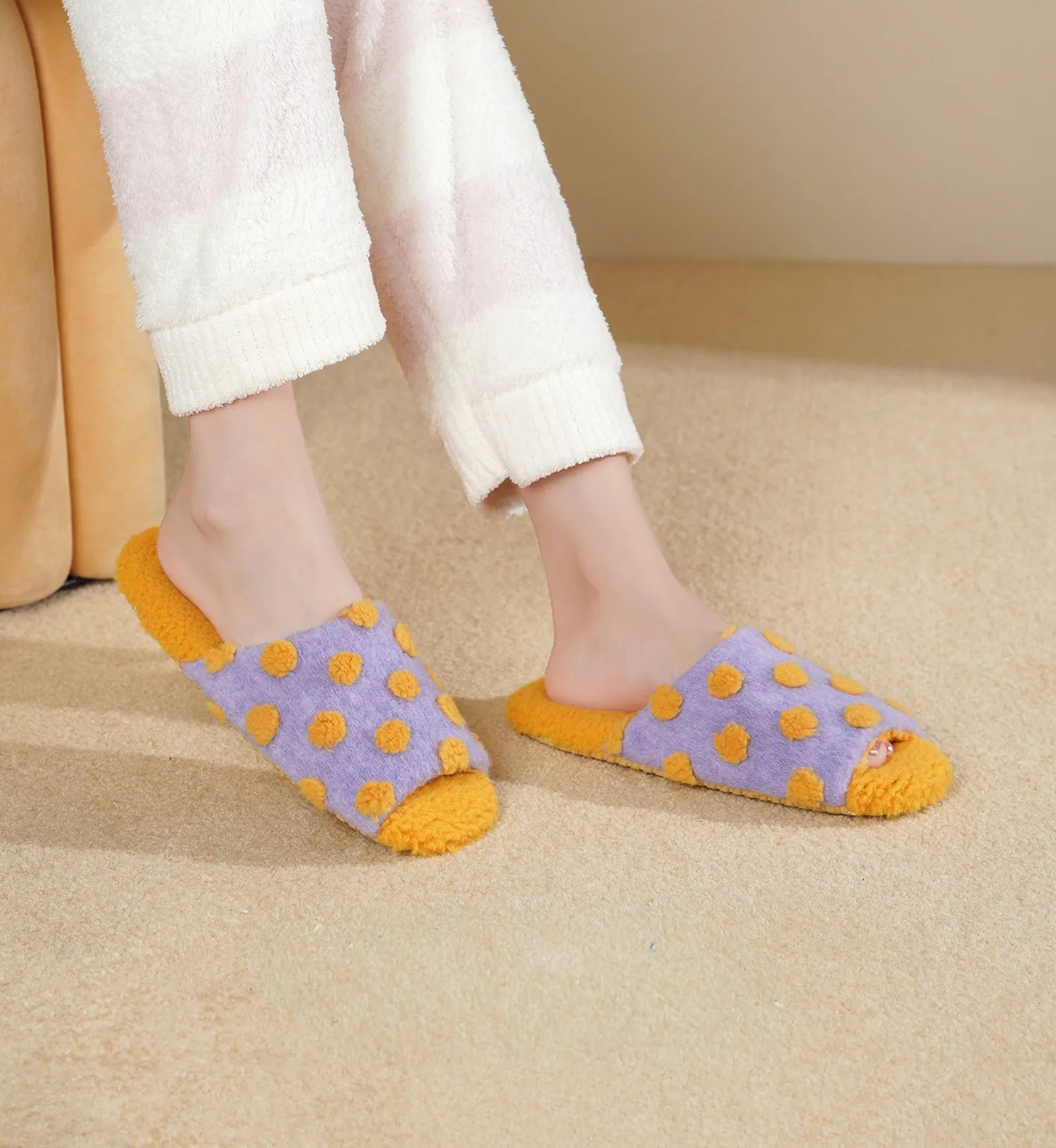 RoomDen Purple Polka Dot Plush House Slippers worn on feet showing fuzzy texture