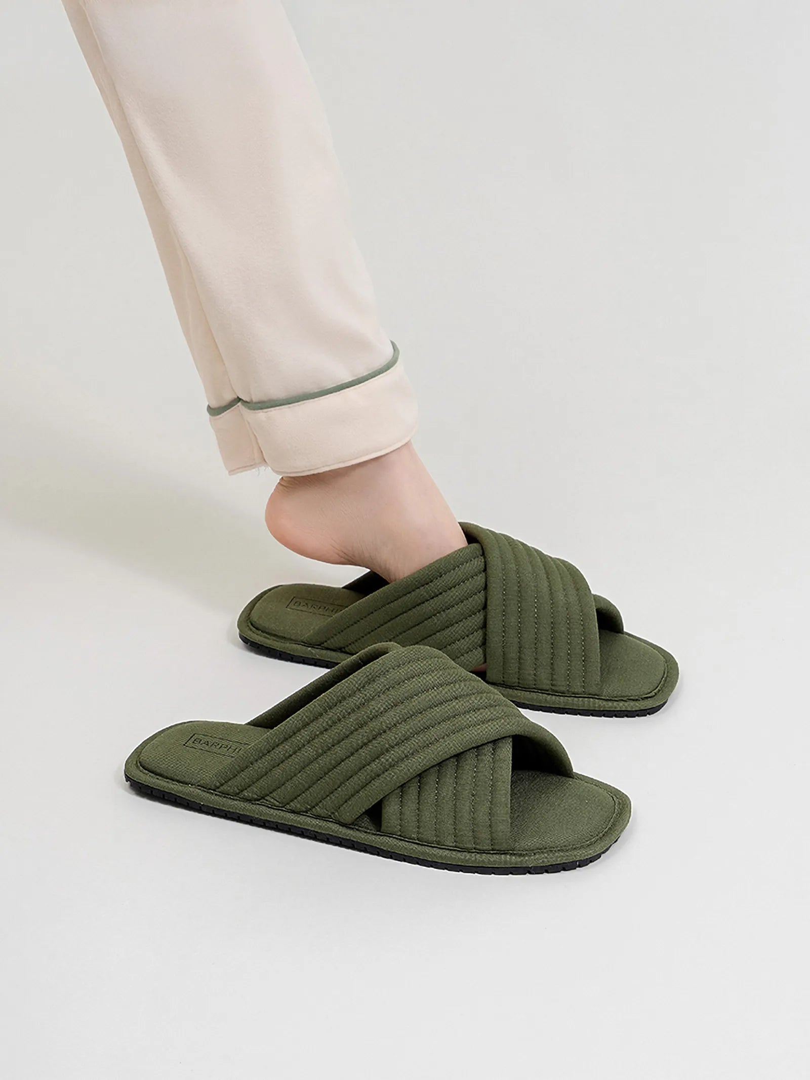 RoomDen Cushioned Quilted Cotton House Slippers in Olive Green worn on feet side view