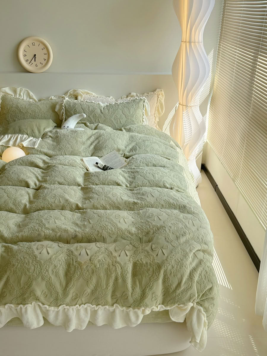 Full view of pastel green bow embossed bedding set with cream edges - RoomDen