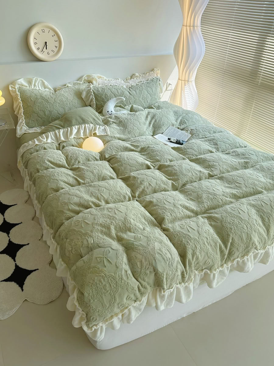 Cozy light green fleece bedding styled with moon plush and glowing bedside lamp - RoomDen