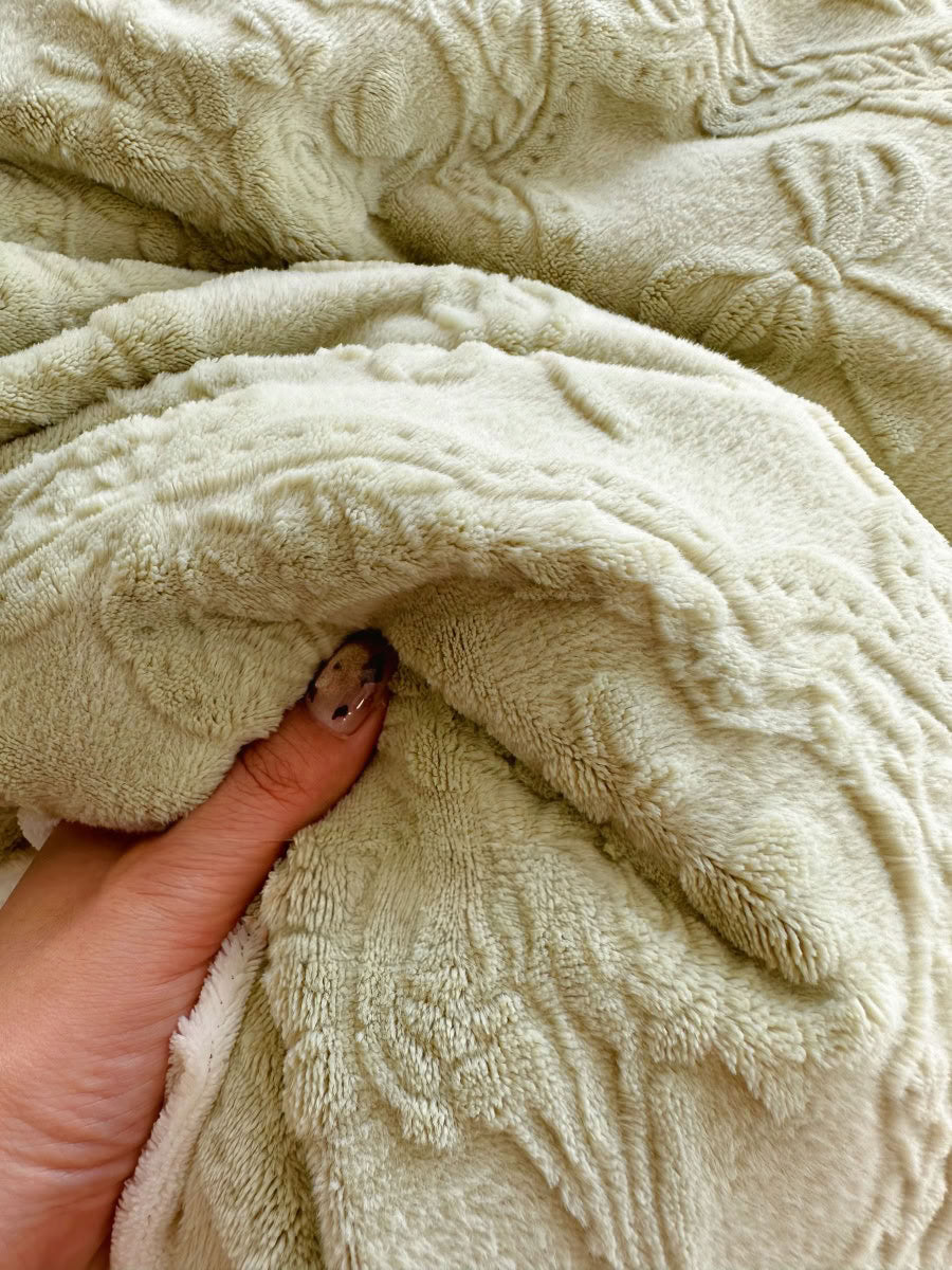 Soft pastel green flannel bedding with cream trim and delicate bow patterns - RoomDen