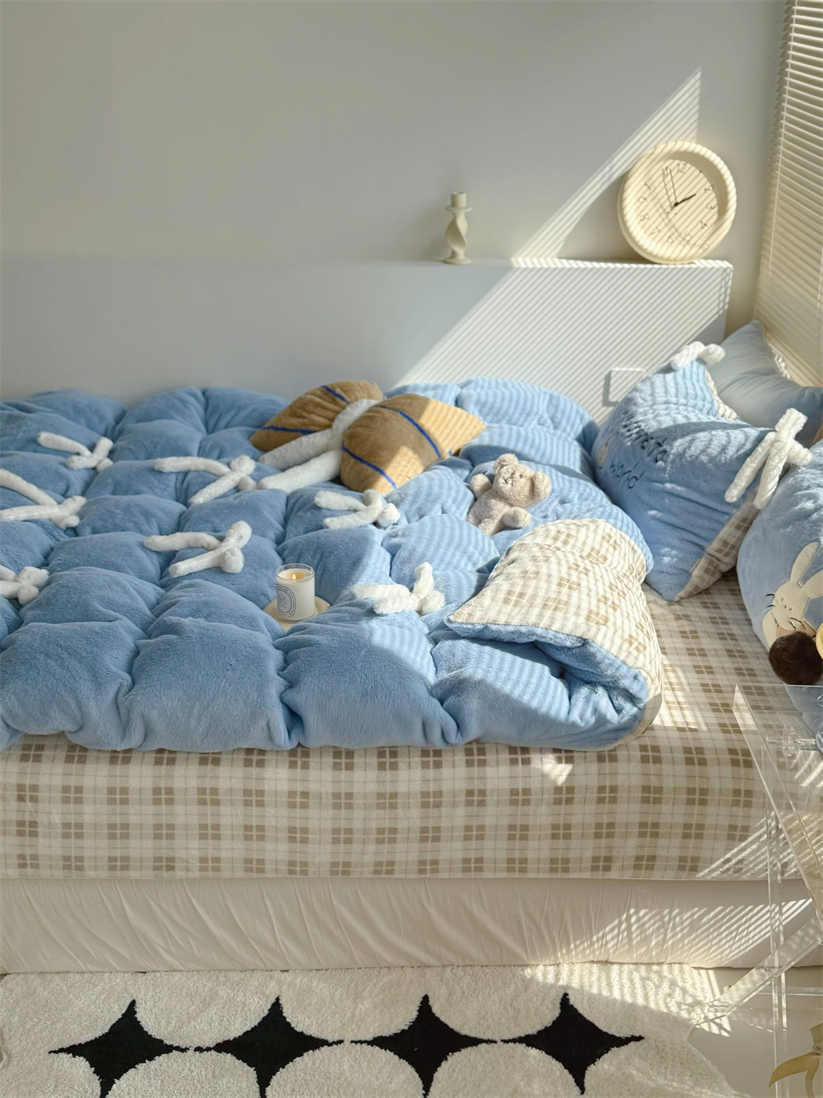 Blue flannel bedding styled with ivory bow ties and beige checkered sheet - RoomDen