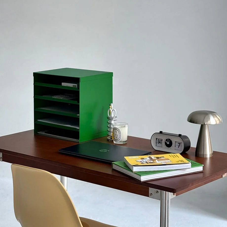 Kelly Green 5-tier metal file sorter shown on a modern office desk with a lamp and clock - RoomDen.
