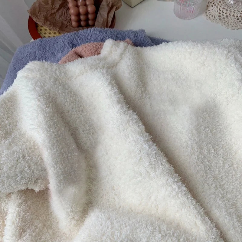 Three color options of the plush fleece pajama top: Cream White, Dusty Rose, and Lavender, folded together - RoomDen