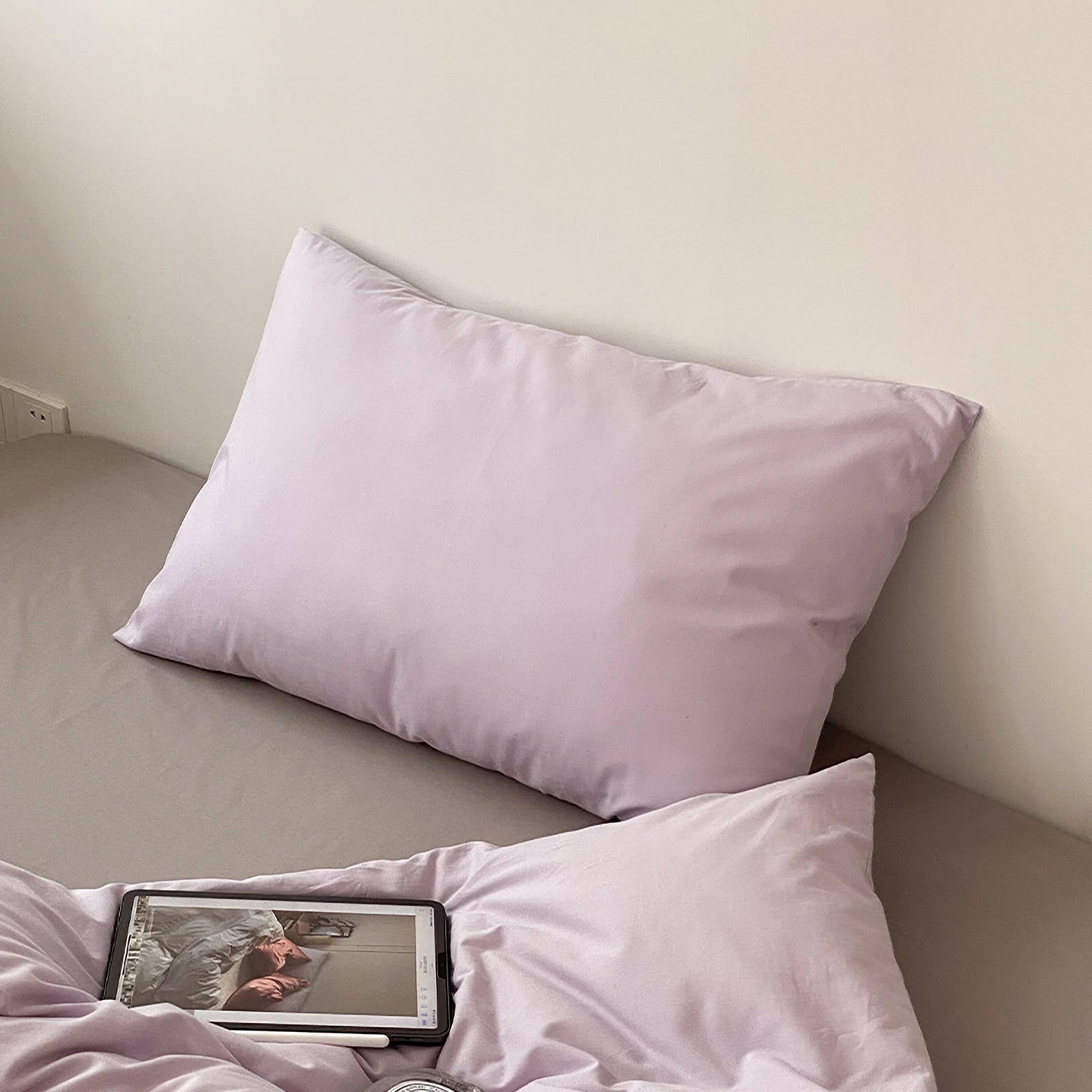 Soft washed cotton solid pillowcase in a minimalist cozy bedroom – RoomDen