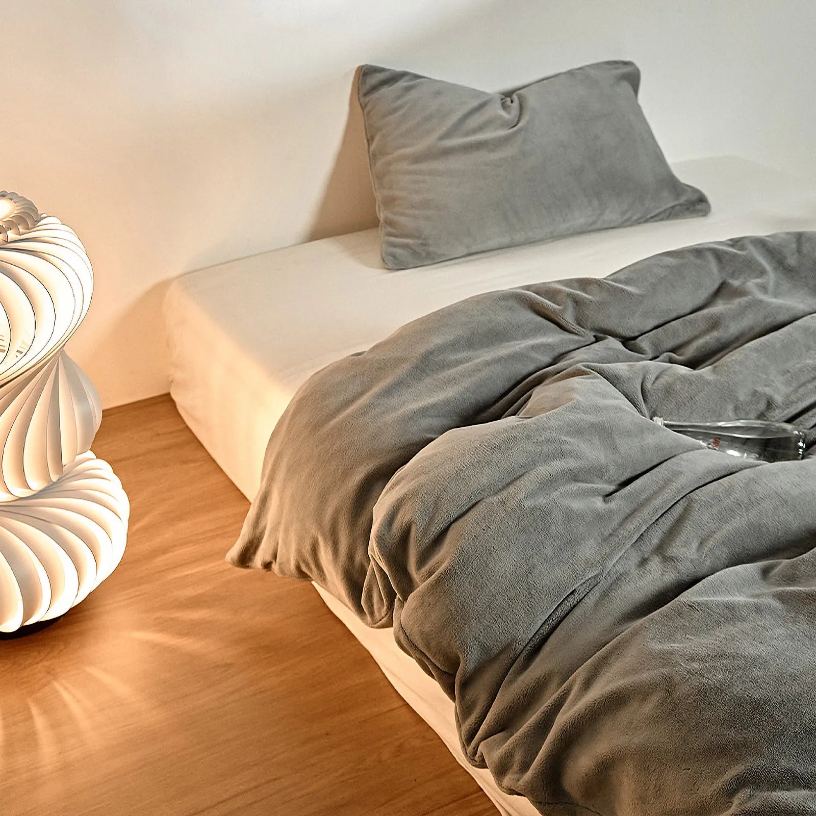 Solid fog-grey fleece duvet cover in warm minimalist bedroom – RoomDen