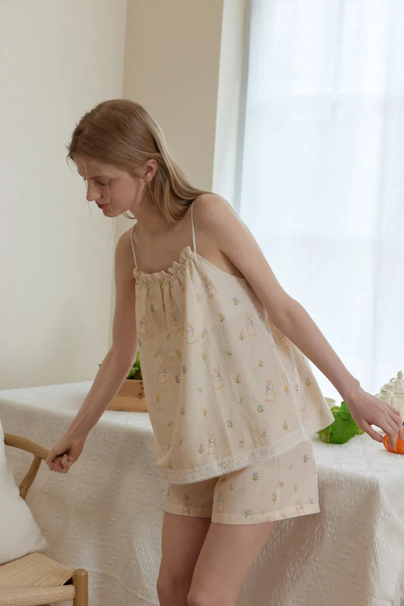Beige cotton pajama set with pastel rabbit and floral print in a soft cozy home style – RoomDen