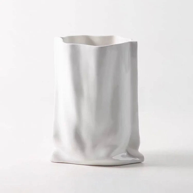 A clean, elegant Frosted Ruched Ceramic Paper Bag Vase in Cream White - RoomDen.