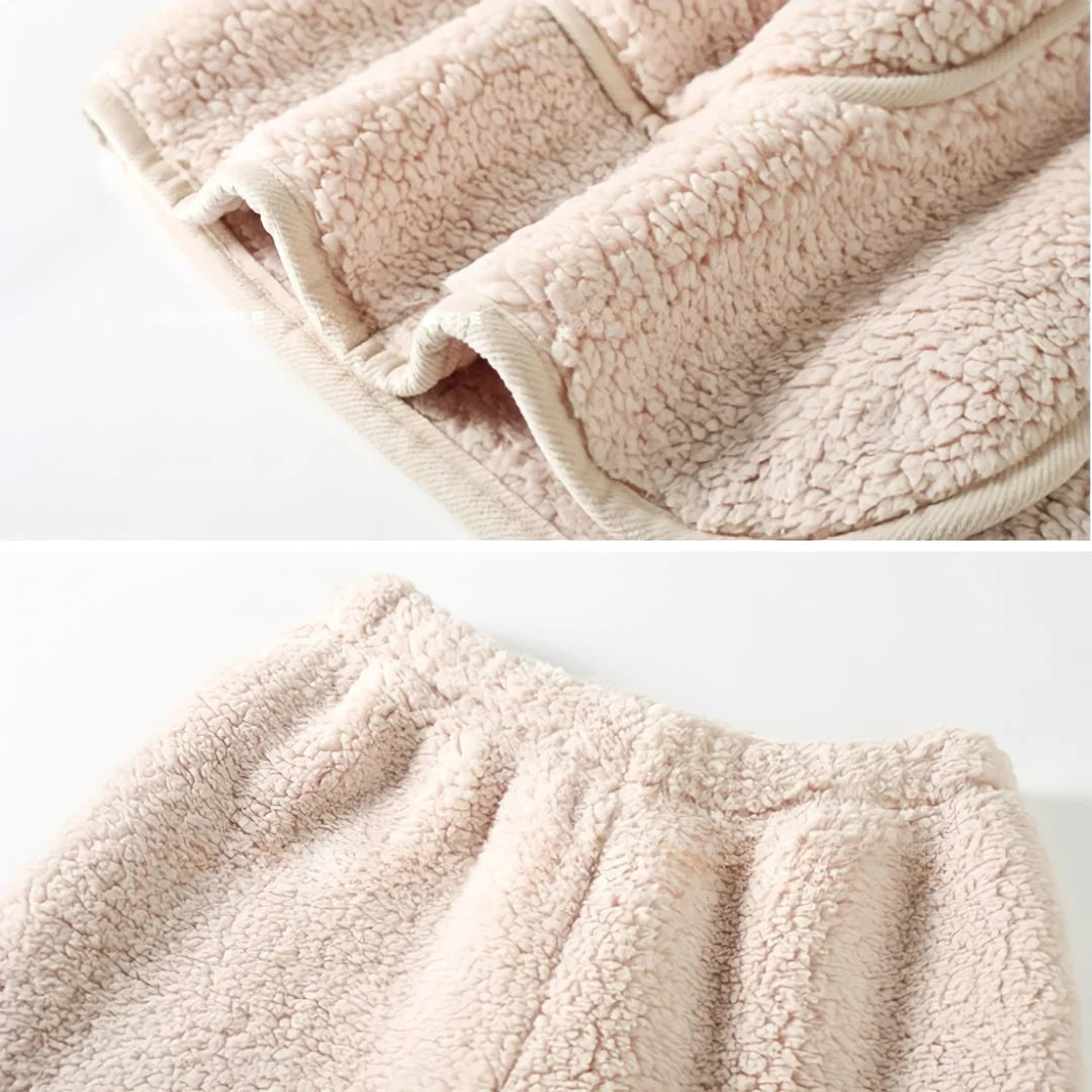 Close-up details of the Creamy Beige Fleece Pajama Set, showing the piped pocket edge and elastic waistband.